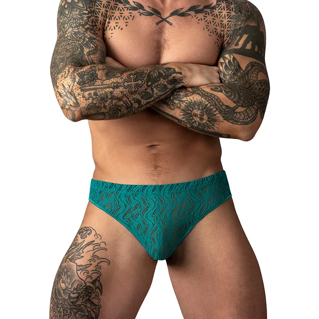 Male Power Ripple Moon Jock in teal size S/M worn from the front to show the patterned mesh pouch
