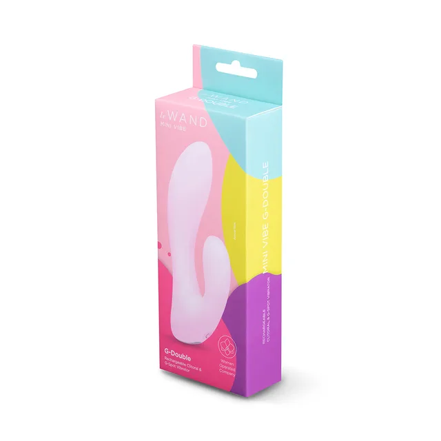 Light pink Le Wand G-Double beside pink-and-teal retail box