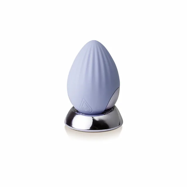 Rocks-Off NIYA 4 cornflower palm-held silicone massager upright on metallic base
