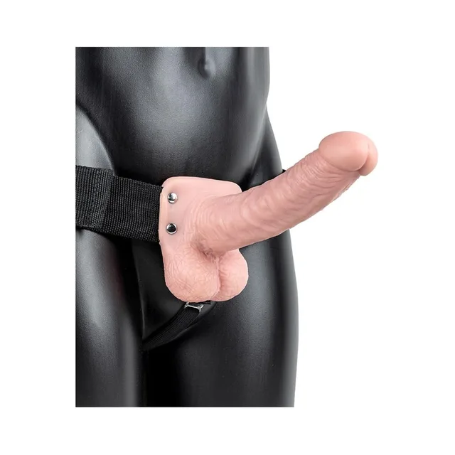 Beige 7-inch RealRock strap-on worn with black harness