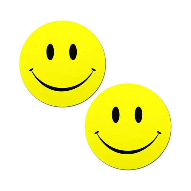 bright yellow round Pastease pasties with black smiley faces