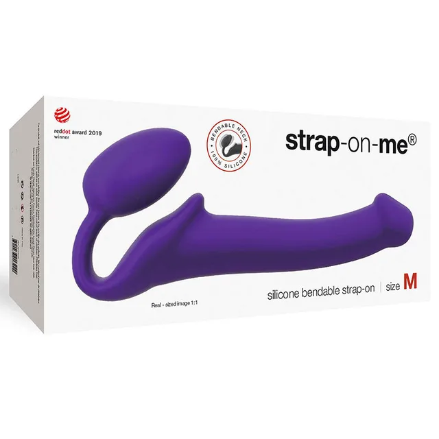 Purple medium Strap-On-Me silicone strap-on displayed across white box