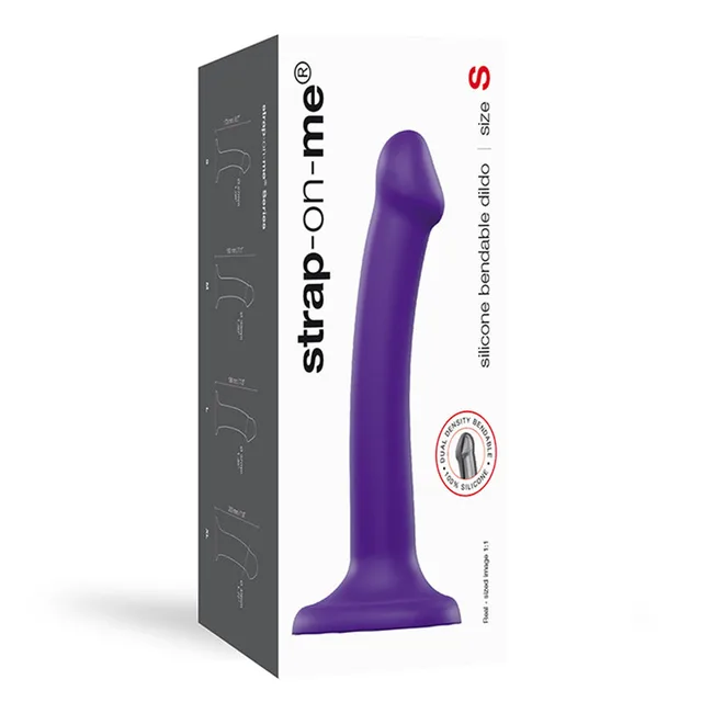 Purple small Strap-On-Me curved silicone dildo beside tall white box