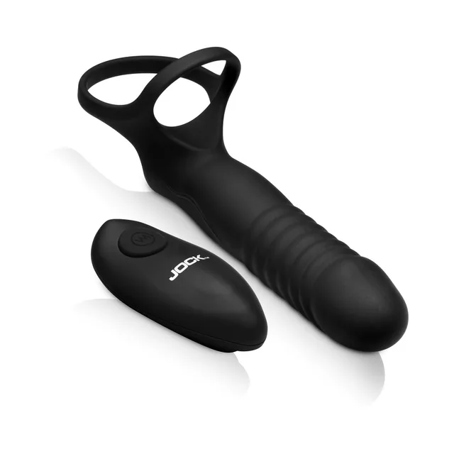 JOCK Enhancers Double Thrust black remote C-ring toy with the wireless remote beside the ribbed insert and dual loops
