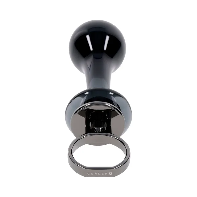 top view of glossy black Blow Pop plug and metal finger ring