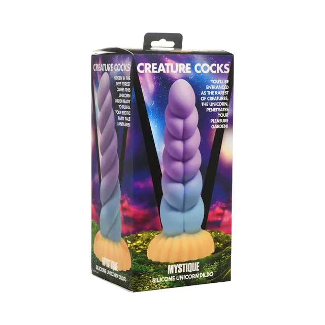 purple Mystique unicorn dildo with spiral horn and gold-tone flared base on box