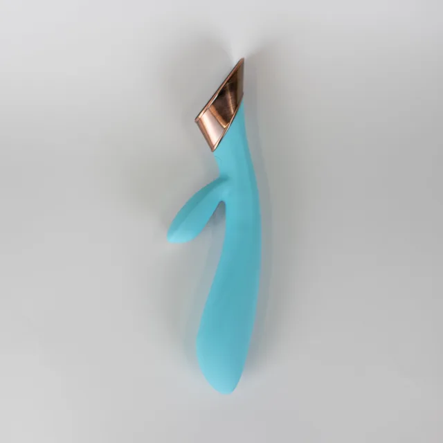 Angled blue Metis rabbit vibrator on pale background