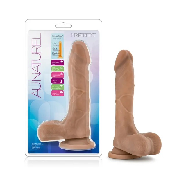 Blush Mister Perfect tan dildo beside clear Au Naturel retail package