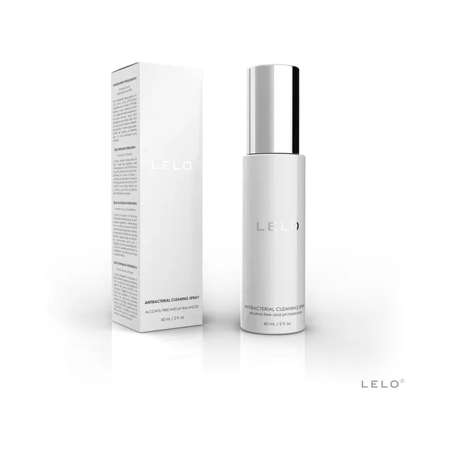 White LELO cleaning spray bottle with silver cap beside carton