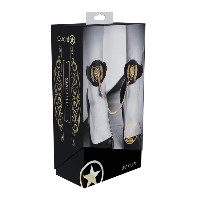 black London leg cuffs with gold embroidered panels and chain on box