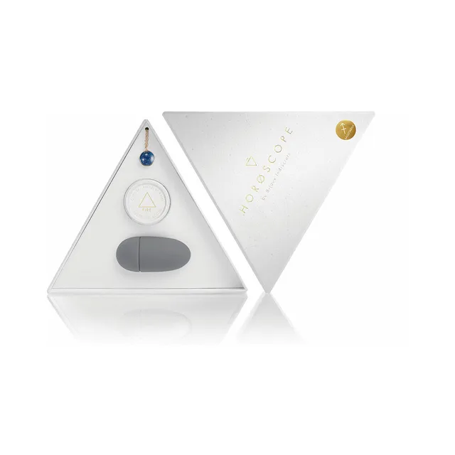 open white Sagittarius Horoscope kit with blue stone necklace balm and gray finger vibrator