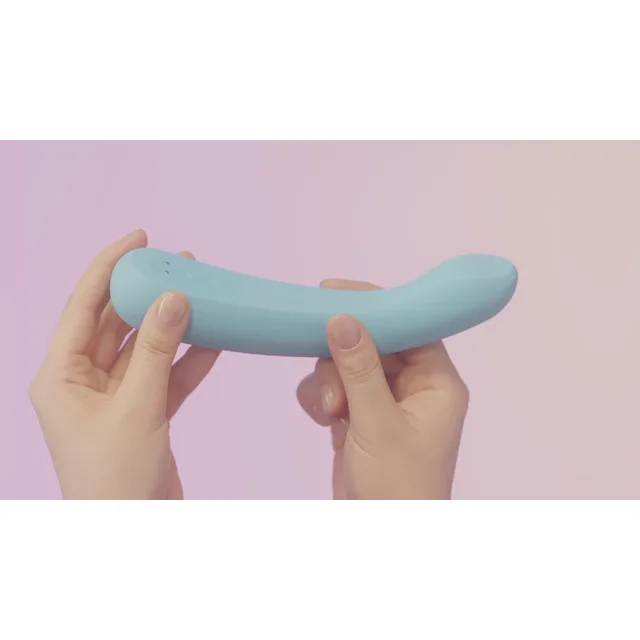 Two hands holding the blue iroha tsuki+ AONAMI vibrator