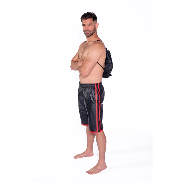 Side view of Prowler RED leather shoulder bag worn over bare shoulders
