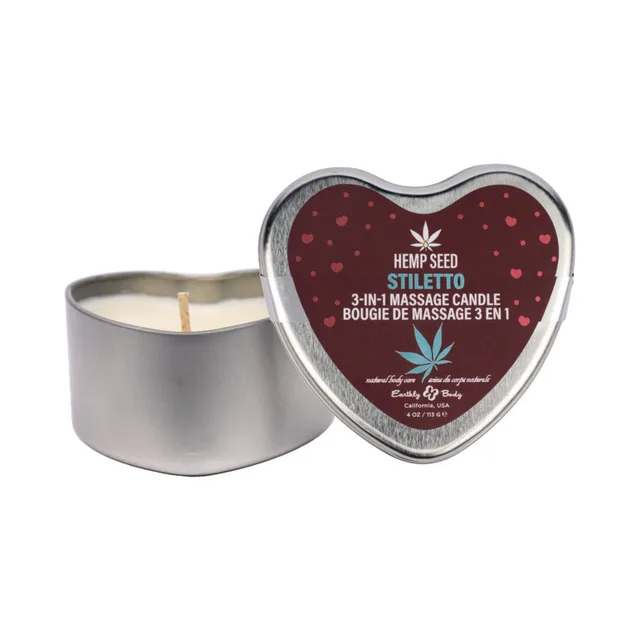 open silver heart tin of Earthly Body Stiletto candle beside lid