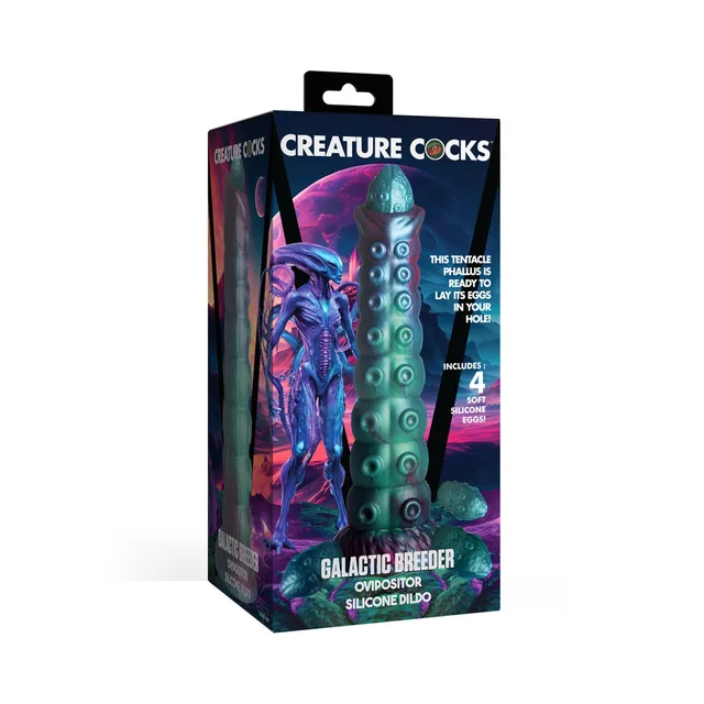 Creature Cocks Galactic Breeder multicolor ovipositor beside illustrated retail box
