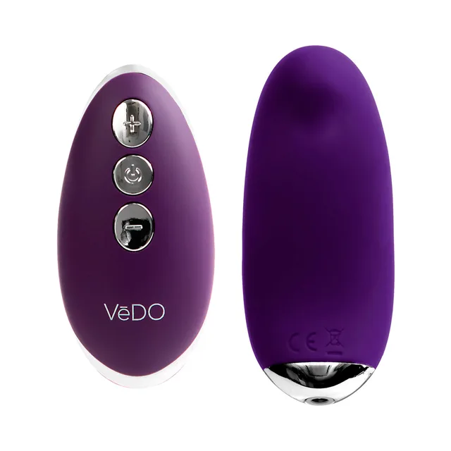 Deep purple Niki panty vibe beside oval three-button remote