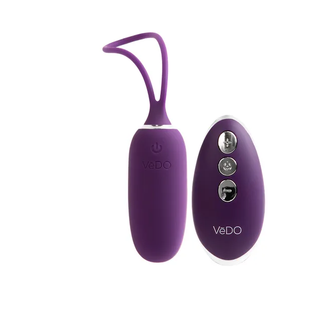 Deep purple Kiwi bullet beside oval three-button remote