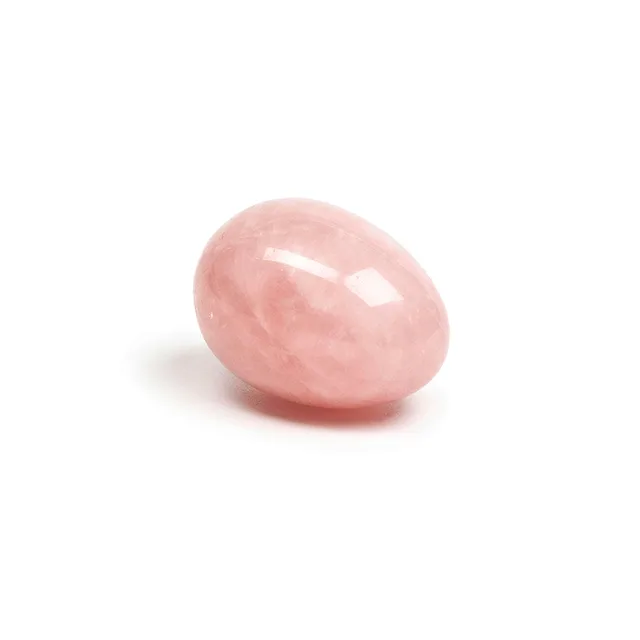 Angled side view of polished Heart rose quartz yoni egg