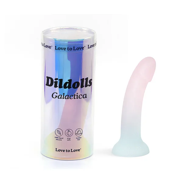 pastel unicorn-color Dildolls Galactica dildo beside cylindrical package