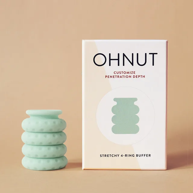 four stacked aqua OhNut rings beside white Customize Penetration Depth retail box
