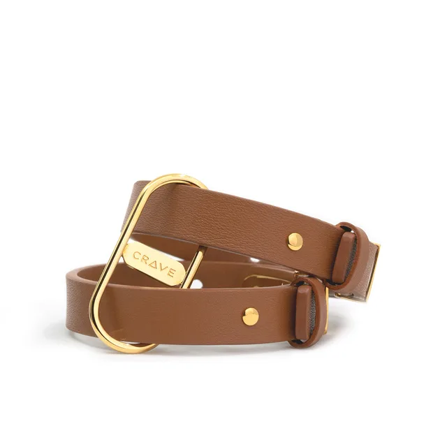 Crave ICON tan leather cuffs stacked with gold-tone hardware