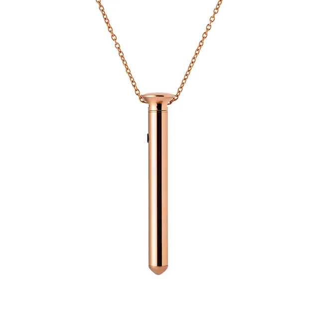 Rose gold Crave Vesper Mini pendant vibrator hanging from chain