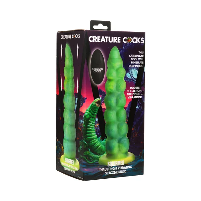 Creature Cocks Squirmer green segmented dildo with black oval remote beside illustrated retail box