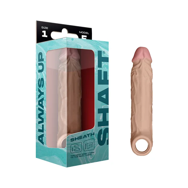 Pine Size 1 Shaft Model F silicone sheath with ringed base beside aqua box