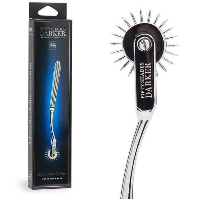 Fifty Shades Darker Adrenaline Spikes Pinwheel black retail carton beside silver spiked wheel and curved handle