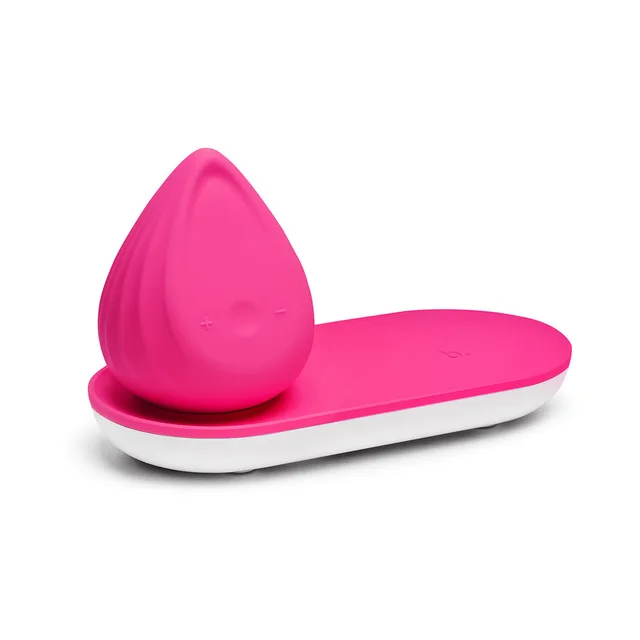 Rose Berry Biird Evii seated on its pink and white charging base