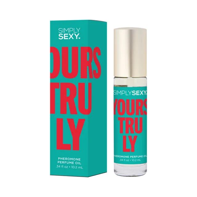 Yours Truly perfume oil roll-on beside teal box with coral lettering