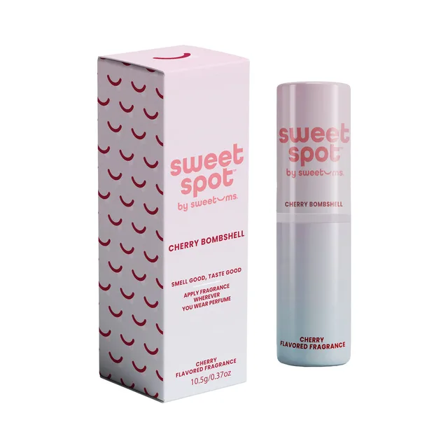 Sweetums Sweet Spot cherry bombshell flavored fragrance displayed as a pink tube beside its retail box