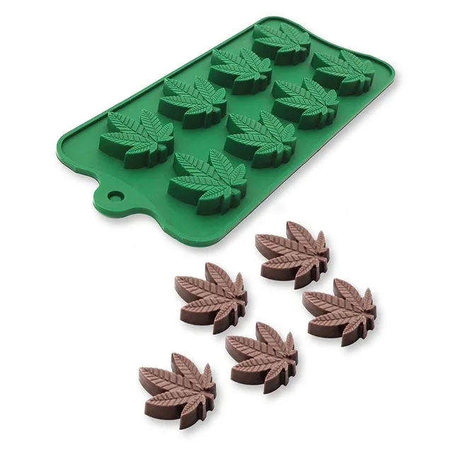 green silicone tray with 11 cannabis leaf cavities and molded chocolates