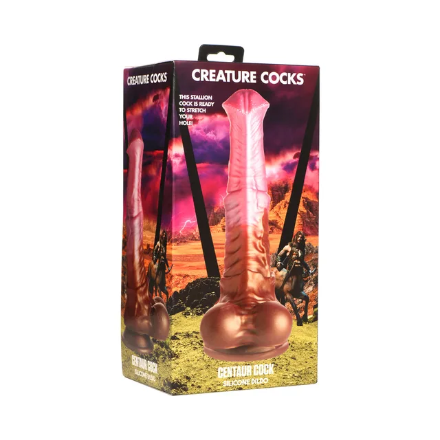 Creature Cocks Centaur Cock pink-and-brown dildo upright in fantasy landscape retail box