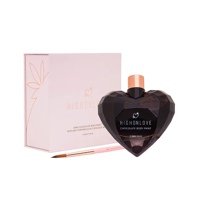 dark heart-shaped HighOnLove Chocolate Body Paint bottle with pink box and brush