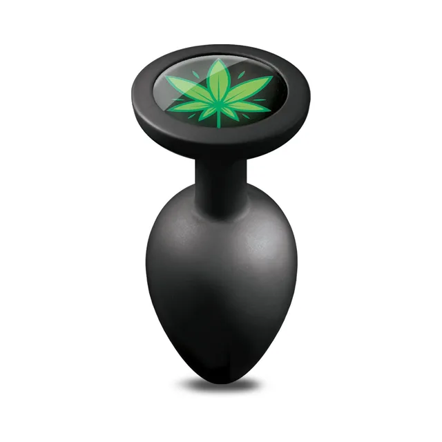 Top view of large black Stoner Vibes plug showing green leaf base medallion