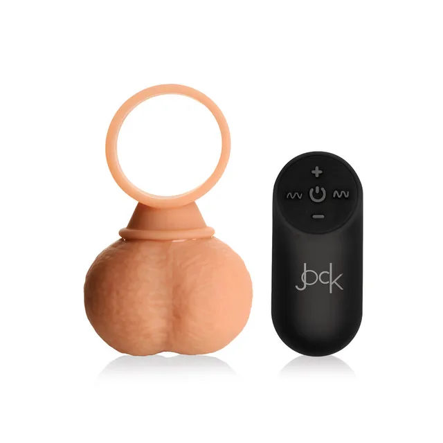 Jock 28x XL ring and balls beside black remote