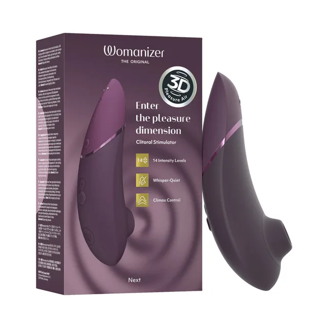 dark purple Womanizer Next curved air stimulator beside its matching purple retail box