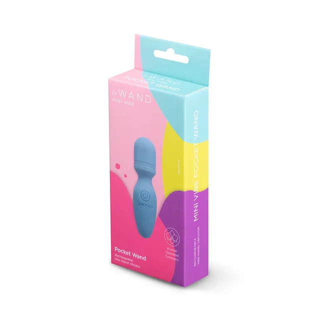 Blue Le Wand Pocket Wand beside pink-and-teal retail box