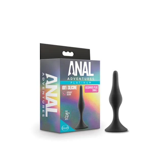 Small black Anal Adventures plug beside retail package