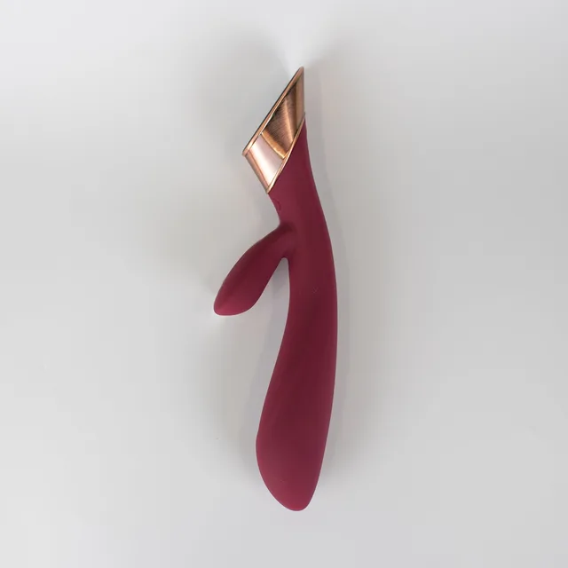 Angled wine-red Metis rabbit vibrator with rose-gold trim