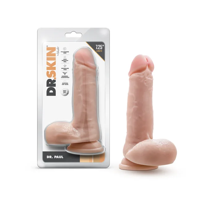Blush Dr. Skin Dr. Paul beige 7.25-inch TPE dildo beside front retail package