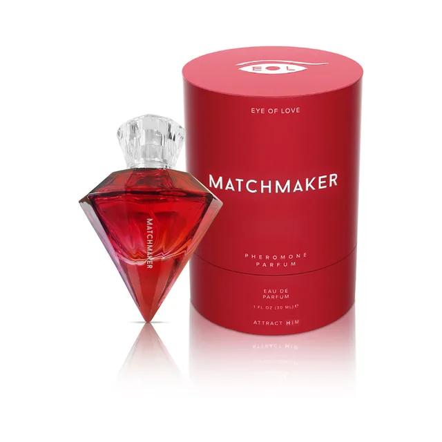 red diamond-shaped Attract Him bottle next to round red packaging