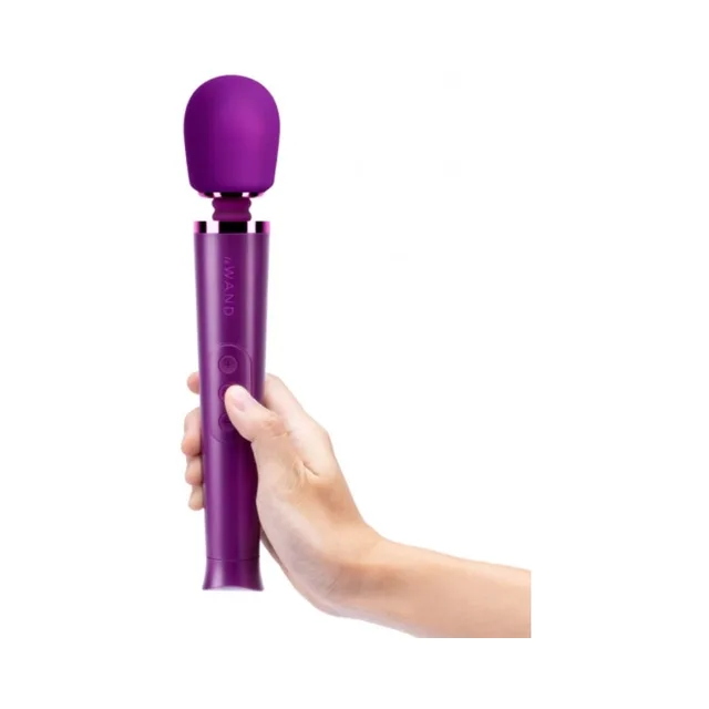 Dark Cherry Le Wand Petite held upright in one hand