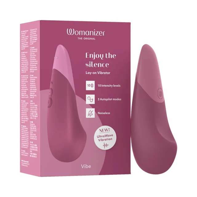 dusky pink Womanizer Vibe vibrator standing beside matching retail box