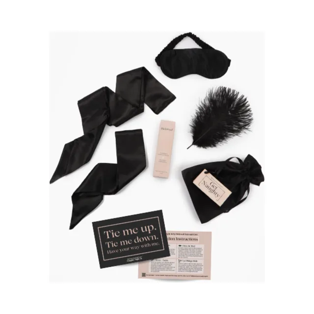 Naughty Night In components arranged around printed activity cards