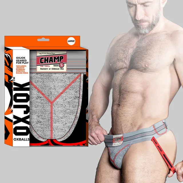 Oxballs Oxjok Champ gray heather jockstrap on model beside orange box