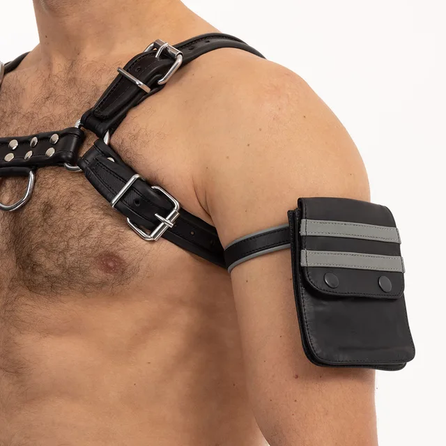 Black and grey Prowler RED leather wallet worn closed on upper arm