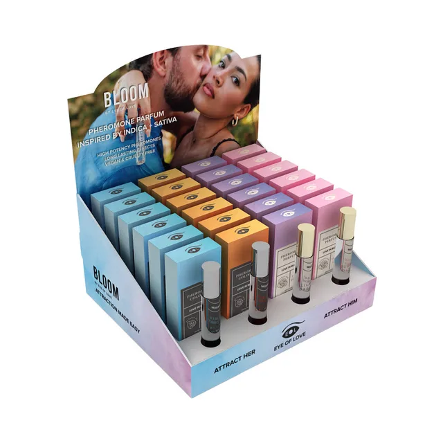 Eye of Love Bloom counter display filled with four colors of perfume boxes and testers