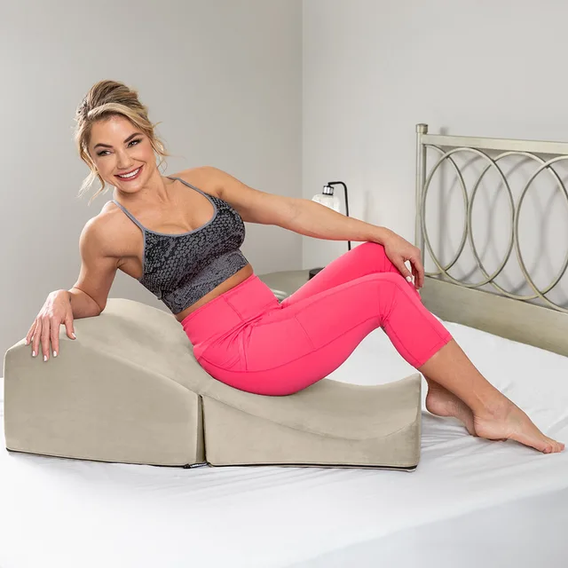 Liberator Flip Ramp Lush Cream positioning pillow seated lifestyle view with the two pieces stacked